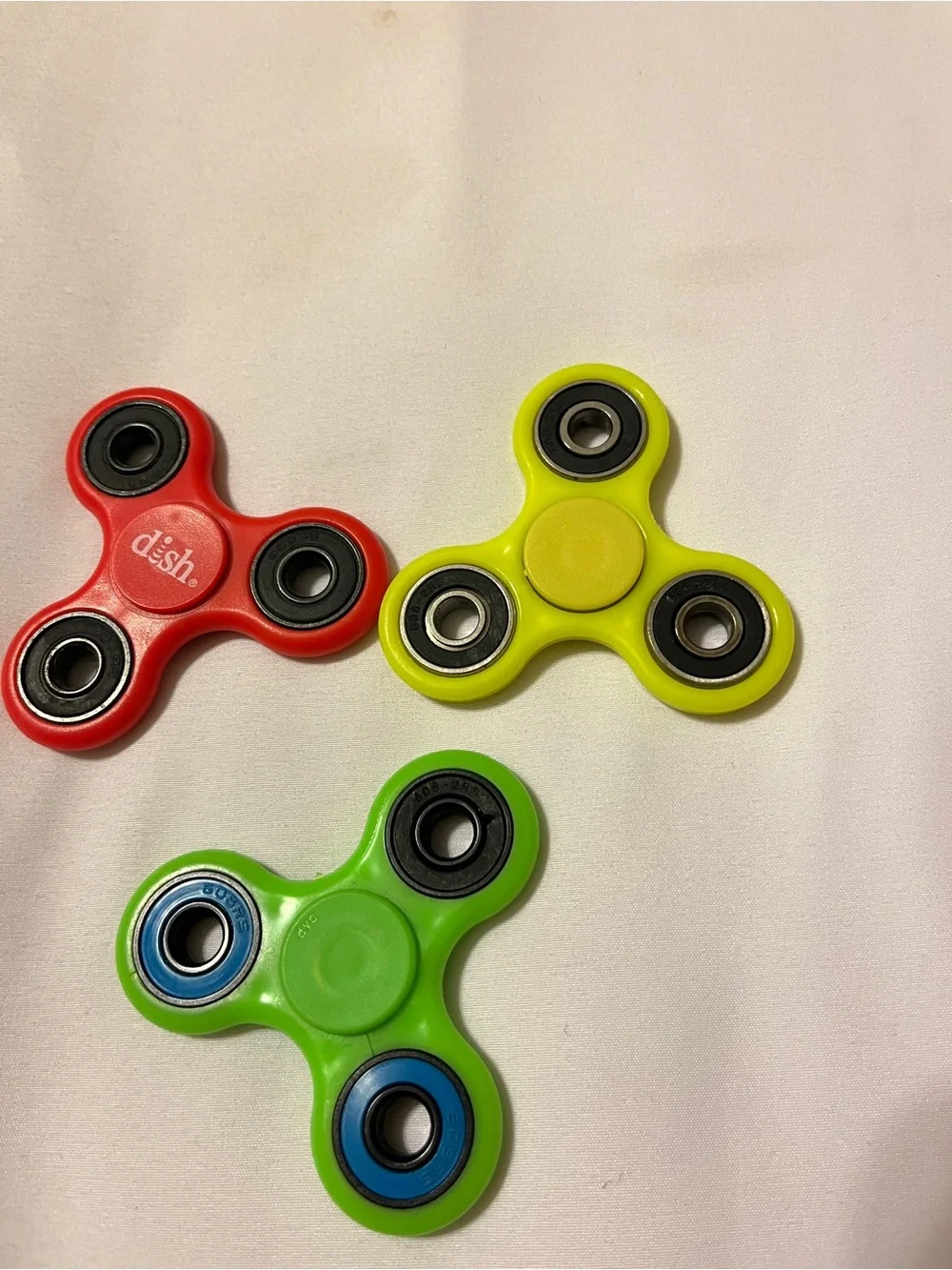 Lot of 3 Fidget Spinners ESPN Dish Network Plastic Toy Red Green Yellow